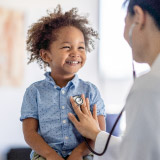 Portrait of boy with doctor