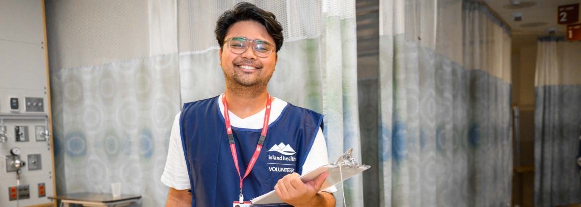 happy volunteer with clipboard in clinical setting