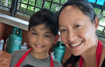 Public health dietician and son cooking together