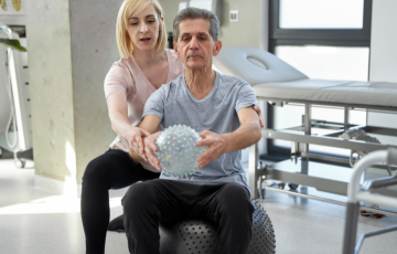 physical therapy session with sitting on ball