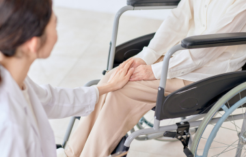 family visitor to person in wheelchair