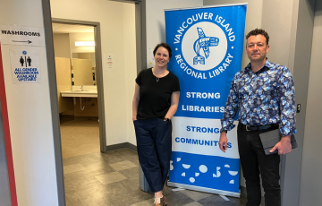 two people standing in front of library branch bathroom